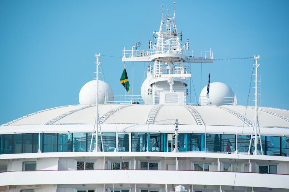 Close-up of a luxury cruise ship's deck, highlighting modern design and opulence under clear skies.