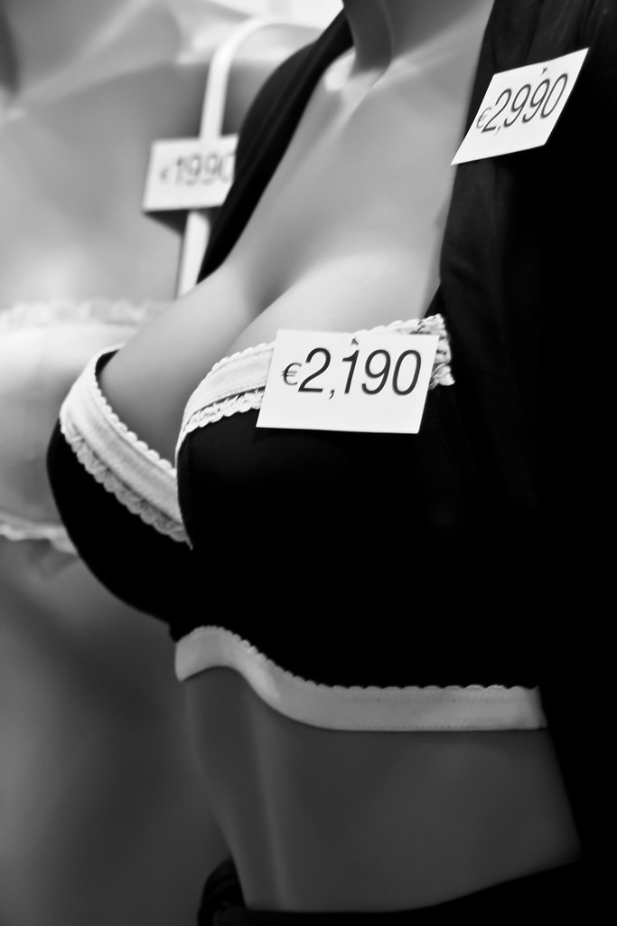 realistic lingerie boutique with bras and soft neutral fabrics detail