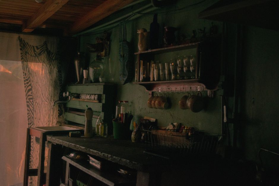 A nostalgic kitchen with vintage utensils and warm lighting, showcasing rustic charm.