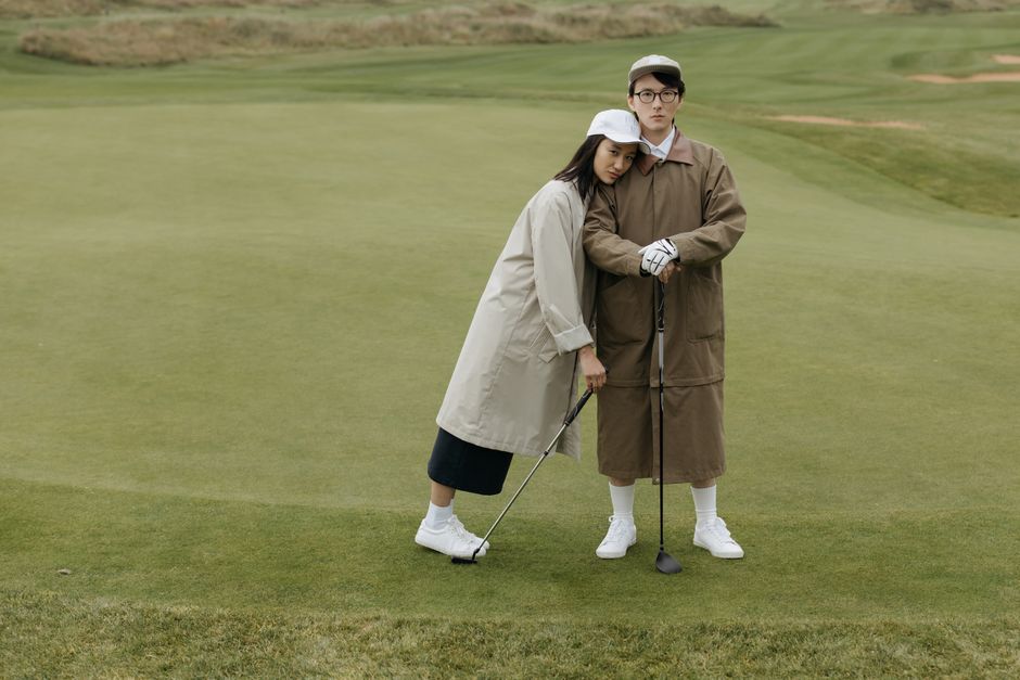 Couple enjoying golf together in casual attire. Perfect for leisure and sports themes.